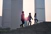 Colleagues walking up steps to the office