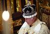 King Charles III, wearing the Imperial State Crown and the Robe of State, reads the King's Speech during the State Opening of Parliament, 17 July 2024