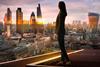 Anonymous business woman looks out on the City